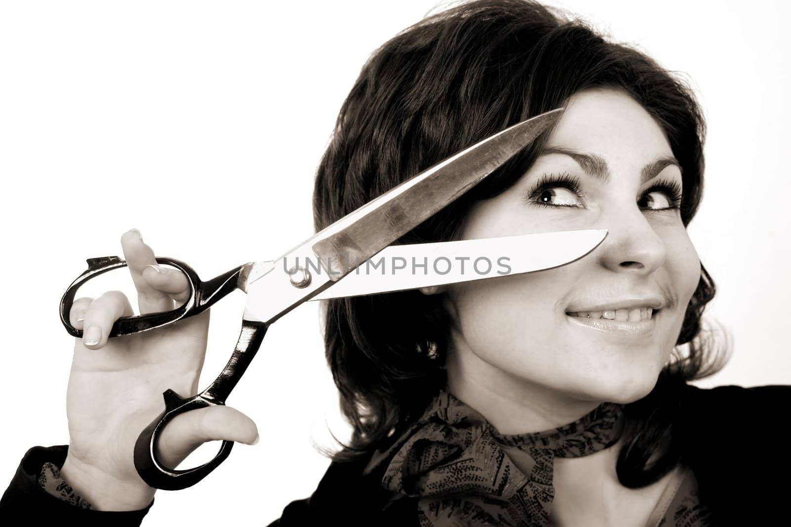 A woman with big scissors going to cut her forelock