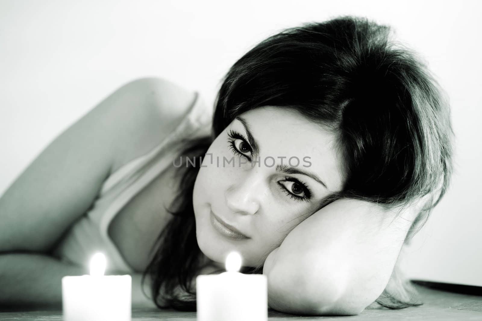 An image of nice girl with two candles