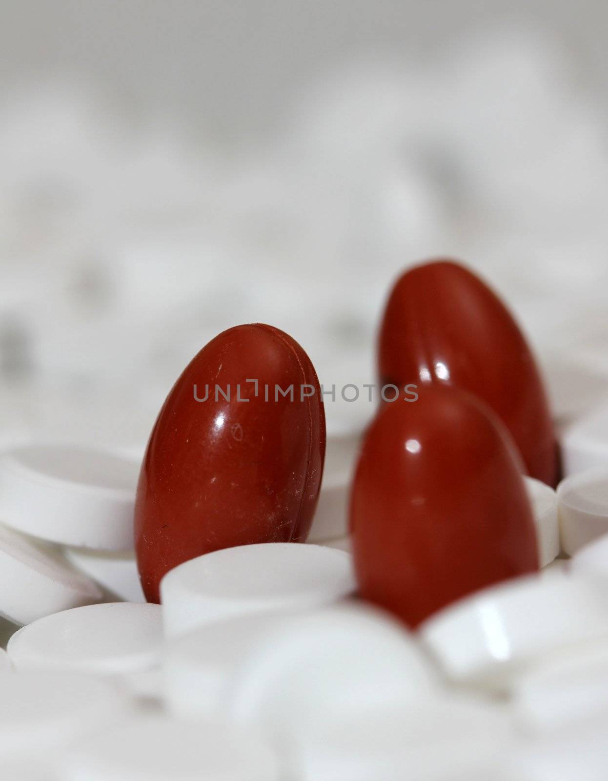 three red capsules