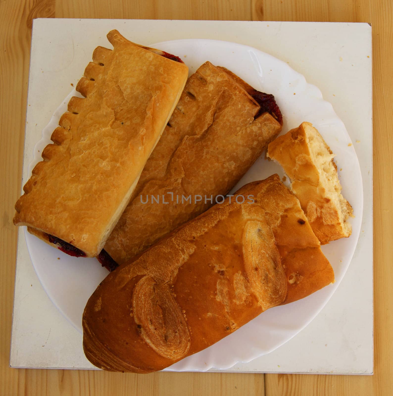 Bread and pies with stuffing on plate