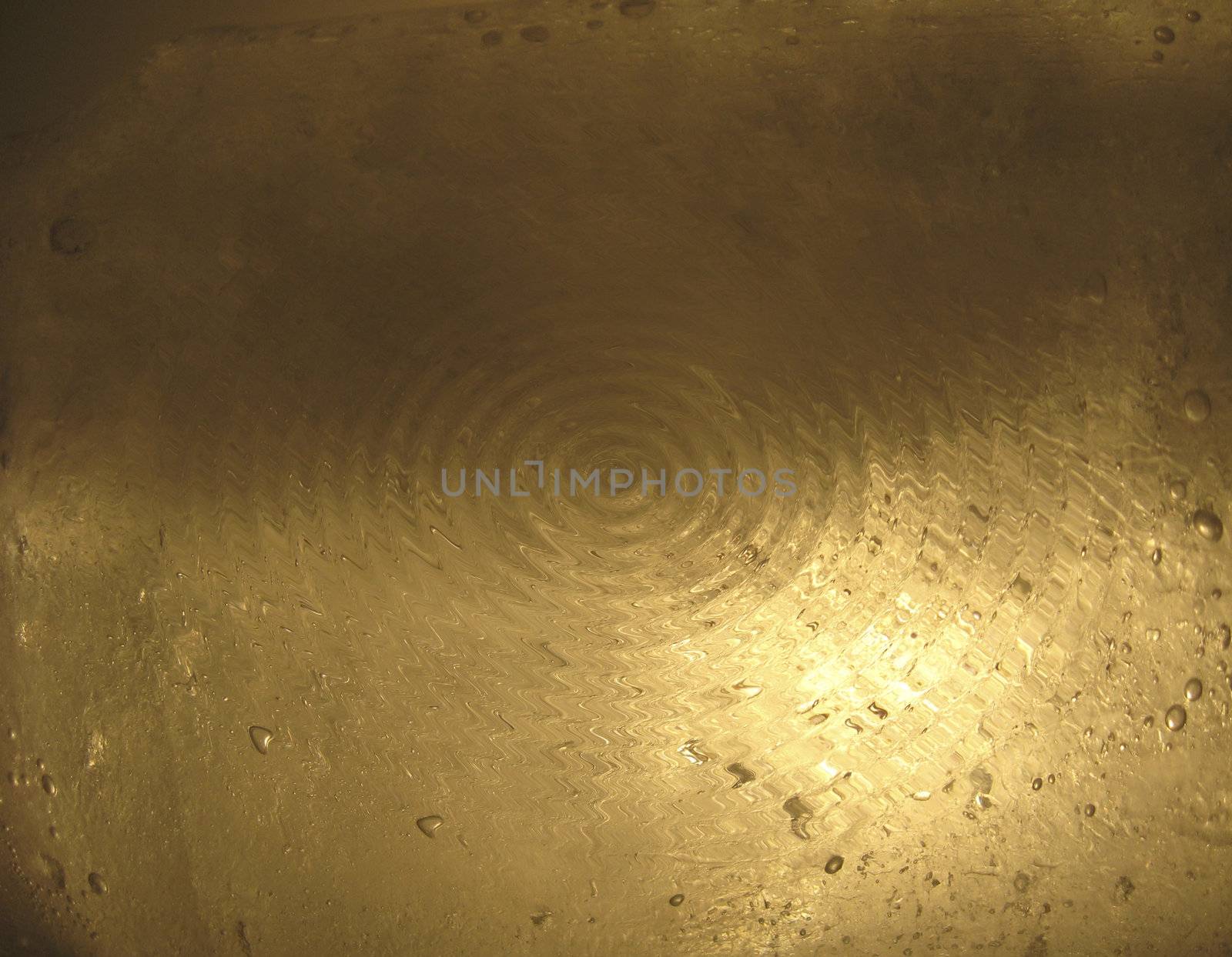 Circles of water on a gold background