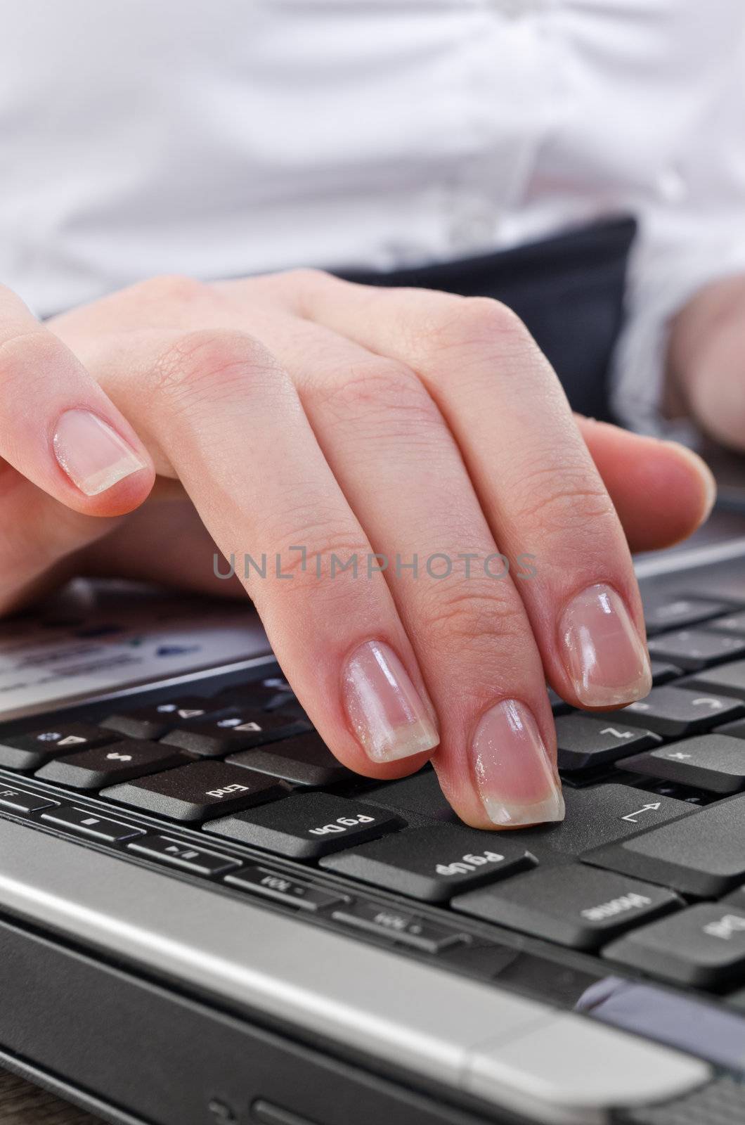 woman pressing enter key  by milinz