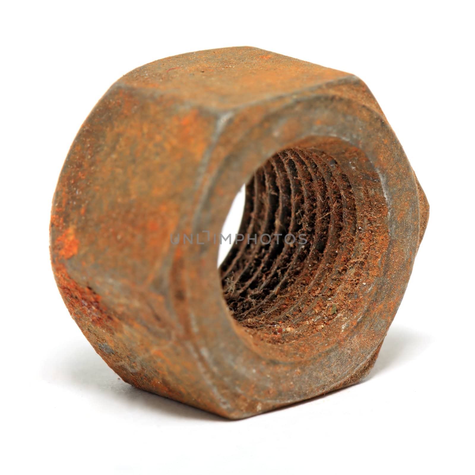 aging rusty nut on white background