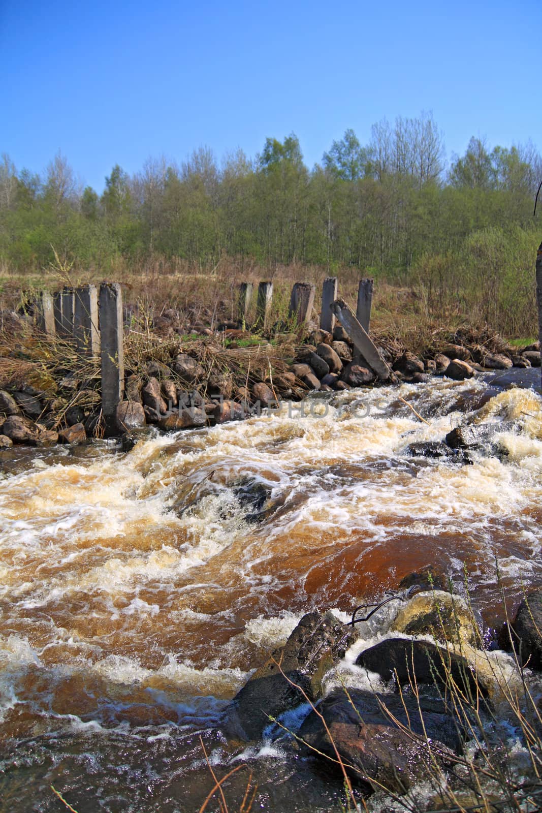 river flow on old destroyed dam