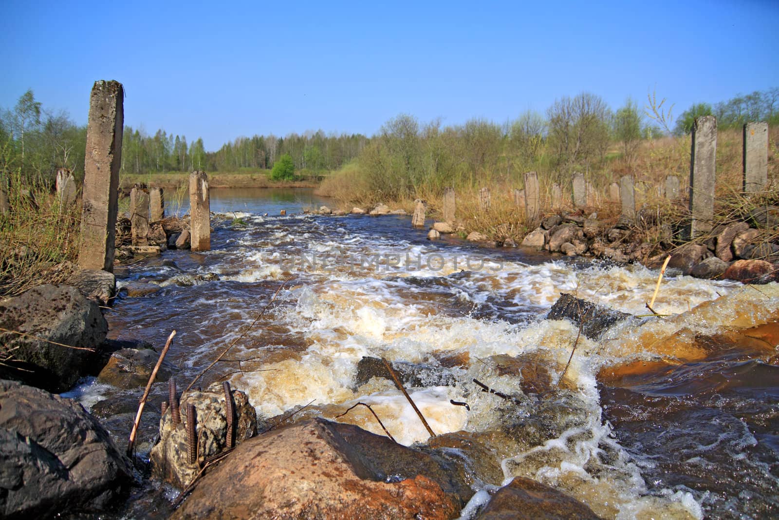 river flow on old destroyed dam