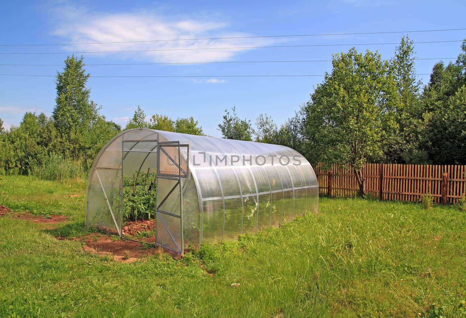 plastic hothouse in rural vegetable garden