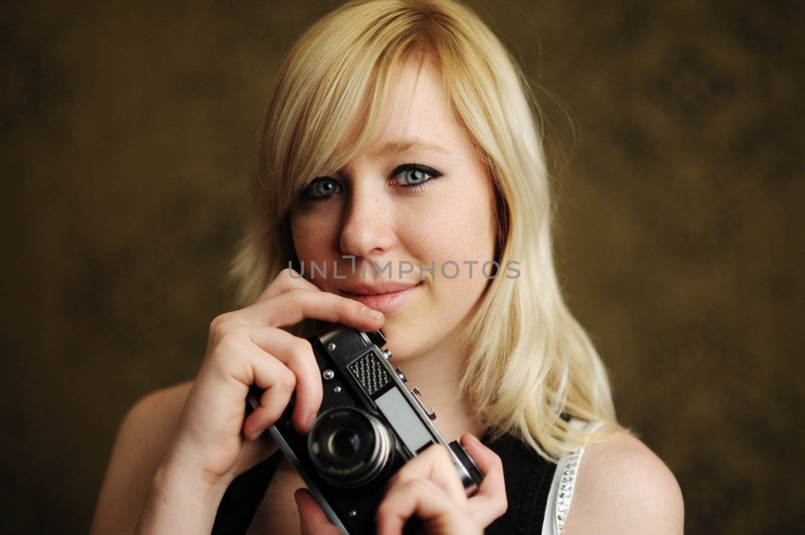 An image of a young woman with a camera