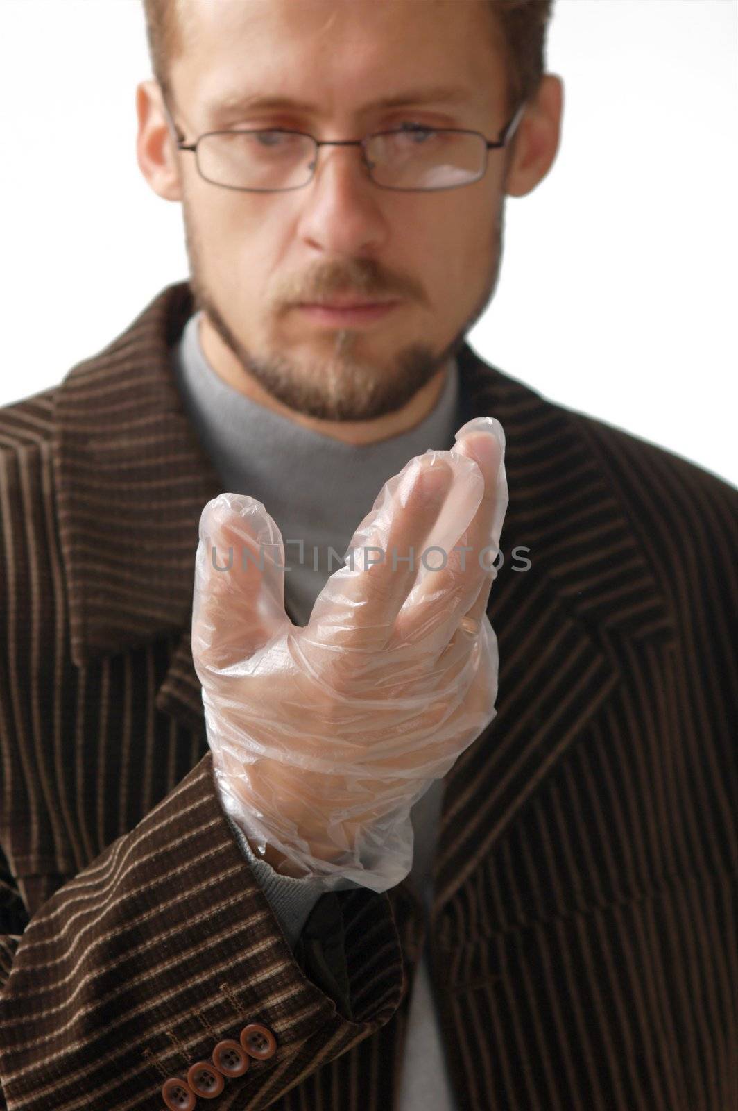 A man putting on a rubber glove