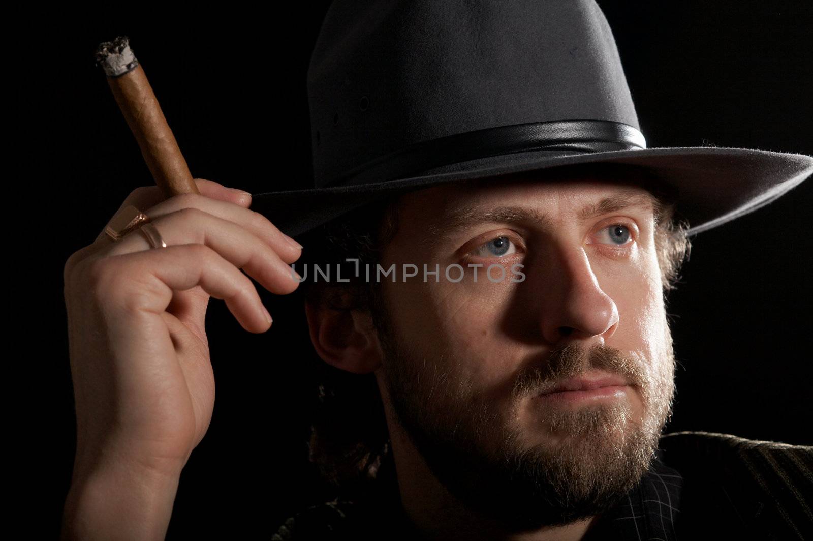 Man with cigar close-up by velkol
