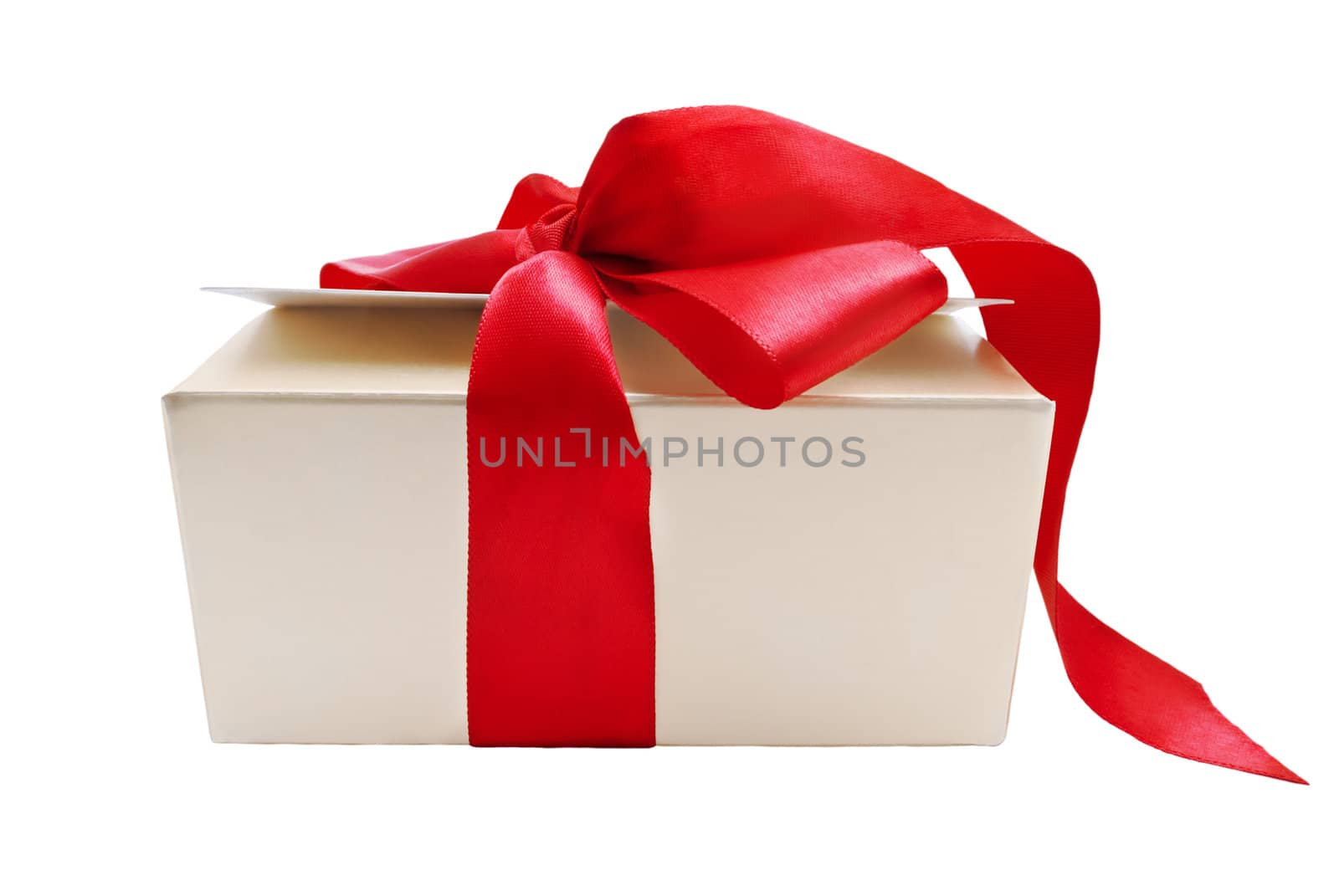 A gold gift box with tied red ribbon trailing onto the ground, isolated on white background.