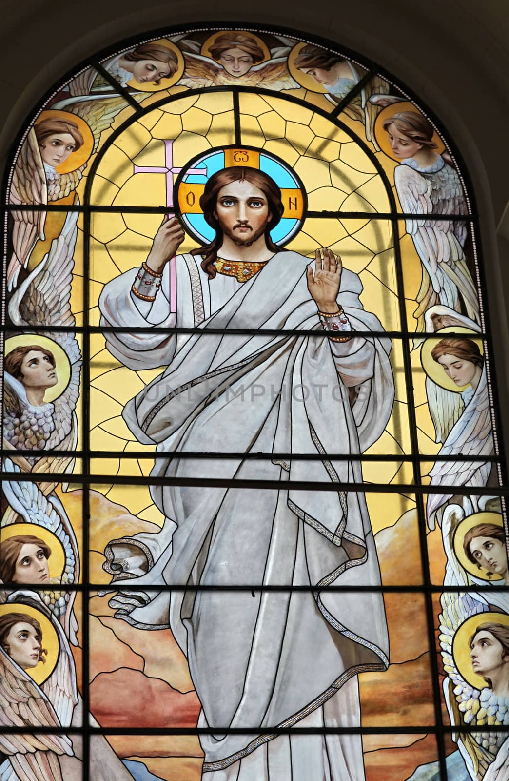 Stained glass window with the image of Jesus Christ and the Angels eleven