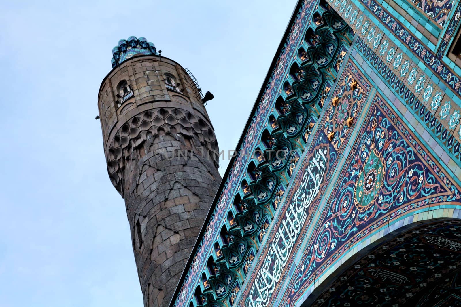 Minaret and mosaic fragment on the wall of the mosque