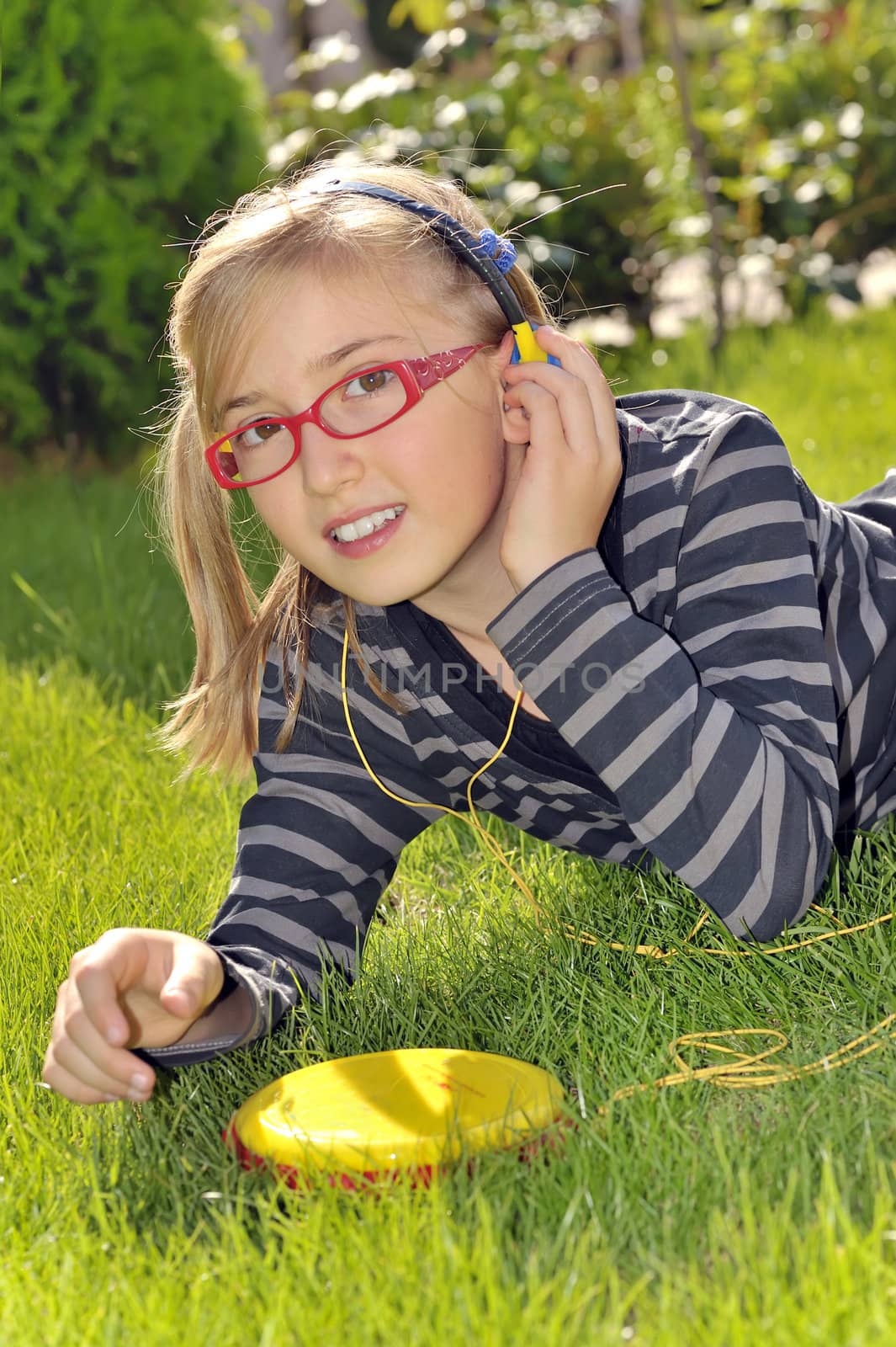 girl listening music in the park