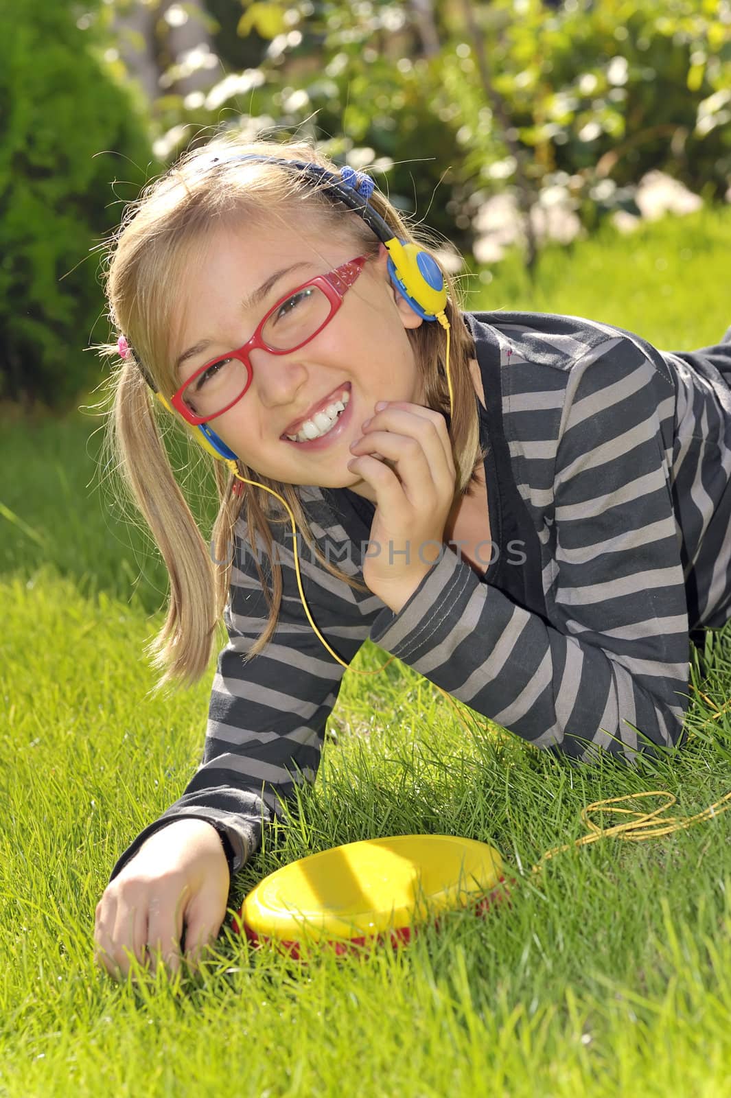 girl listening music in the park