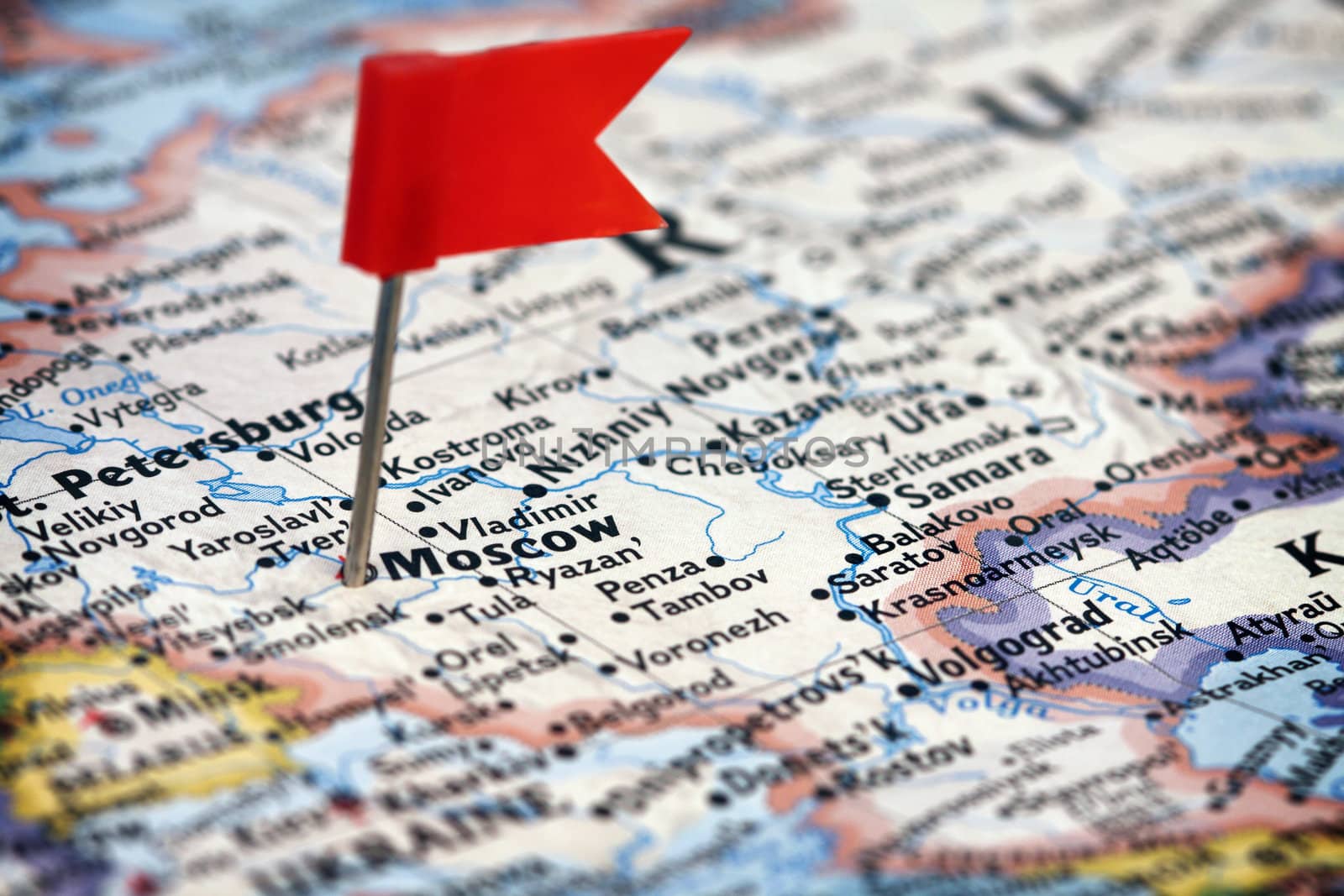 Red flag pushpin in the map of Russia pointing Moscow