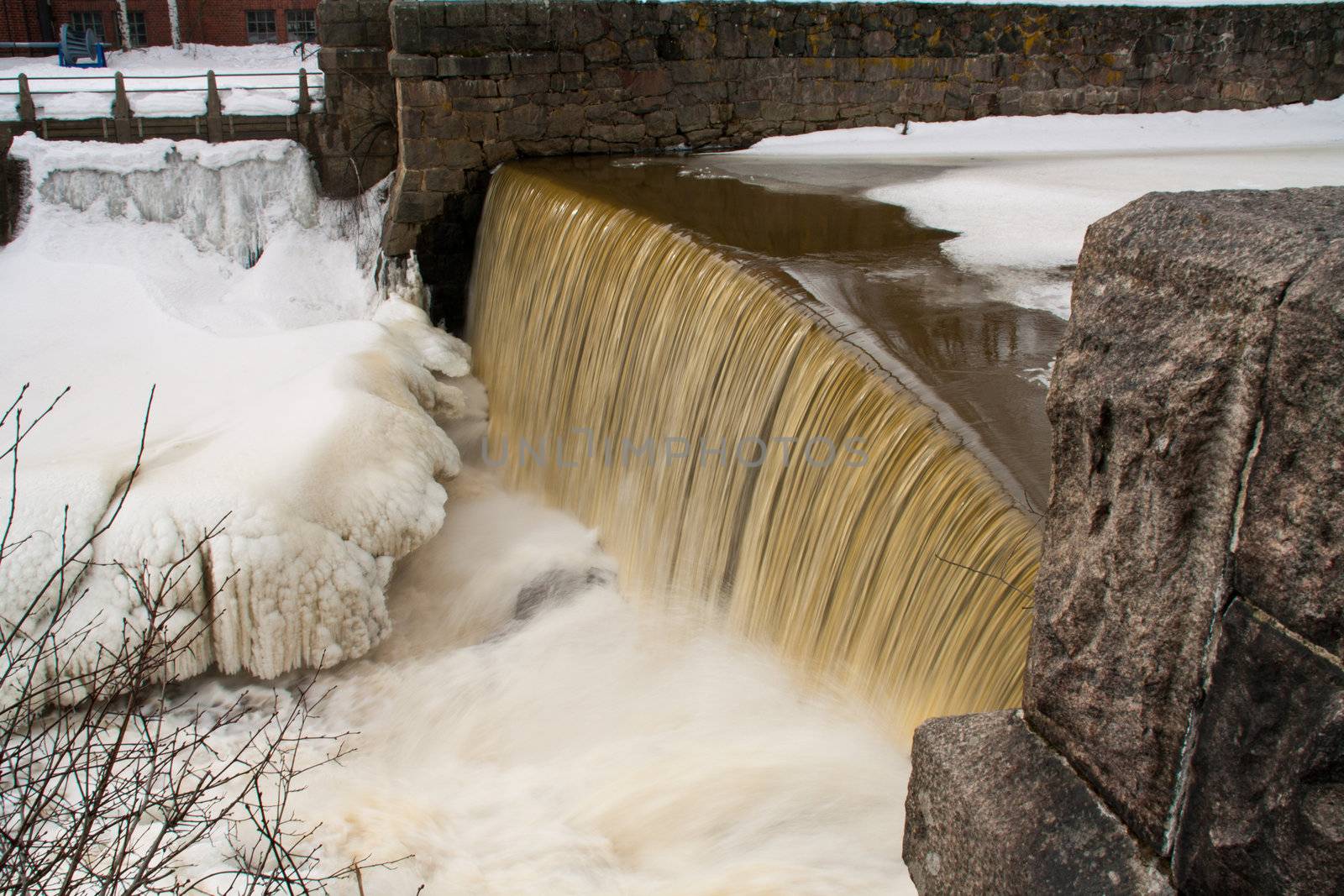 small waterfall at winter scene.