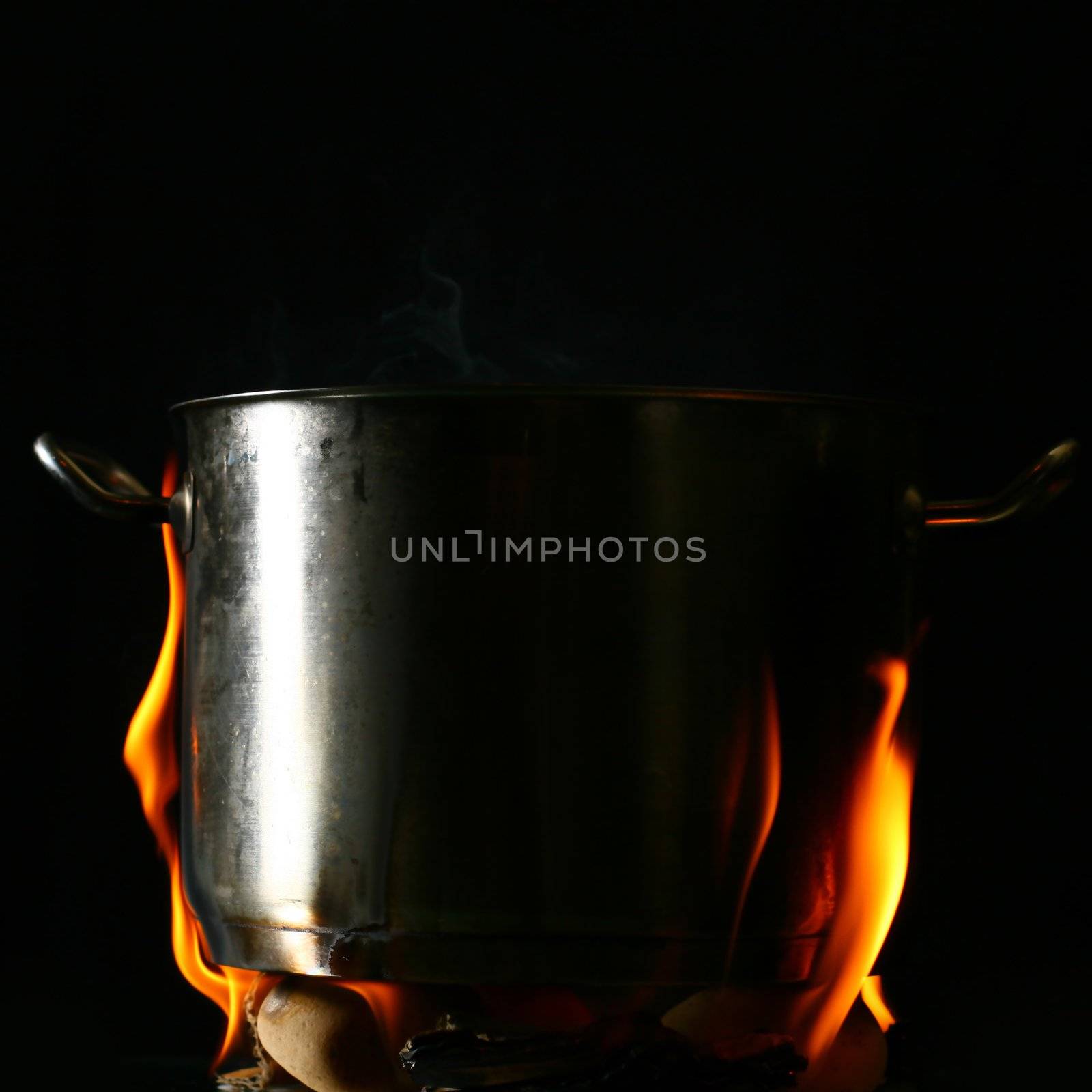 big pan and smoke on black
