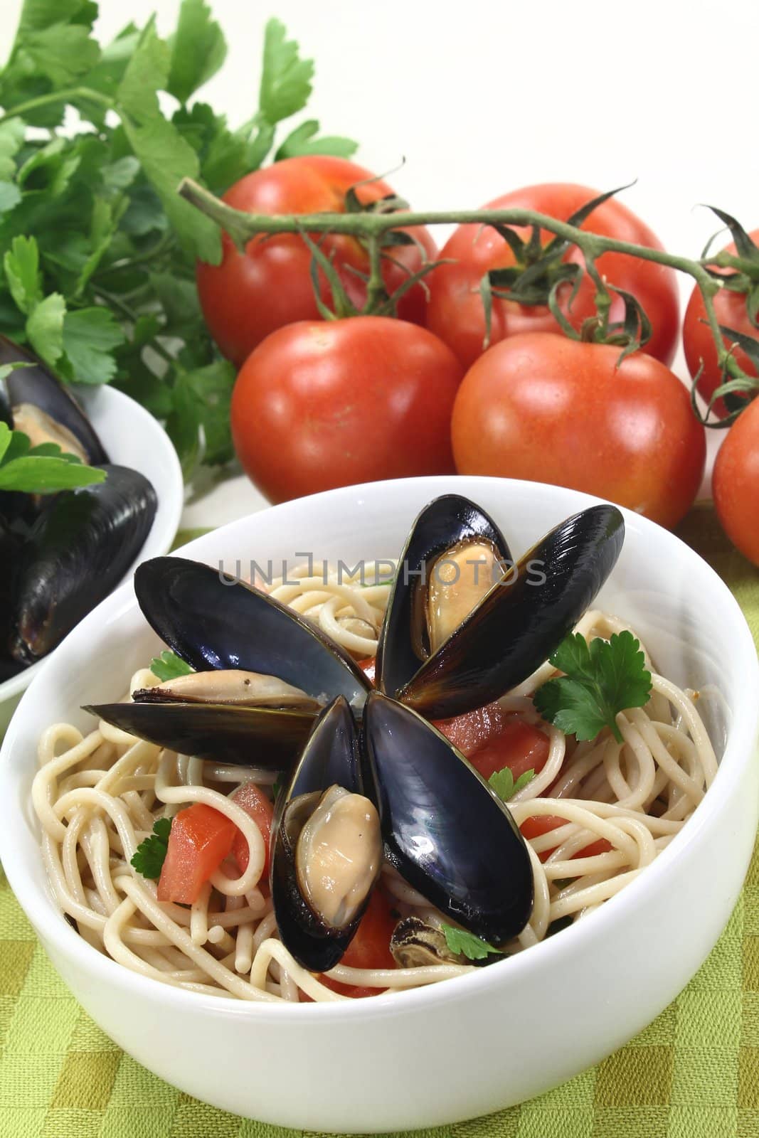 a bowl of spaghetti, mussels and tomato