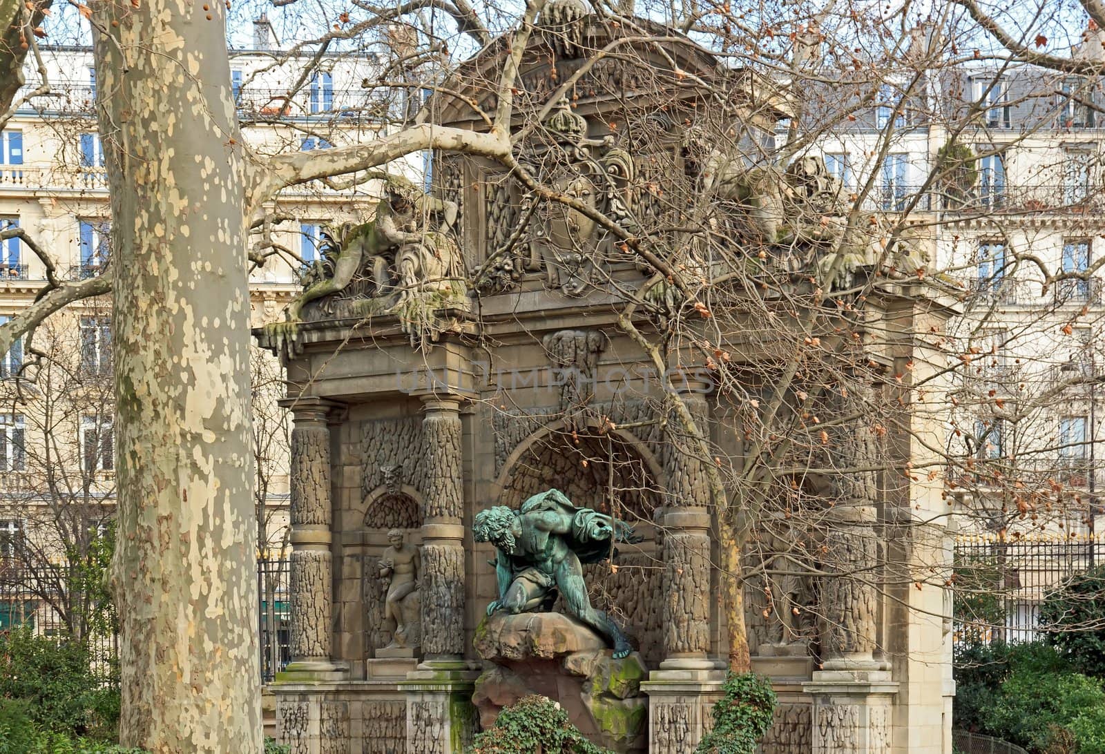 Medici fountain through the trees, statue of Polyphemus  Paris France