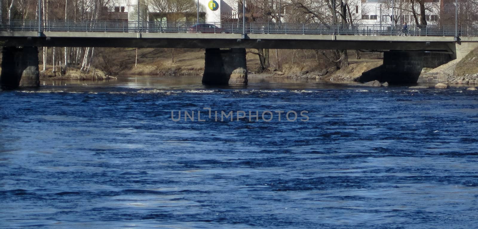 Blue water and concrete bridge