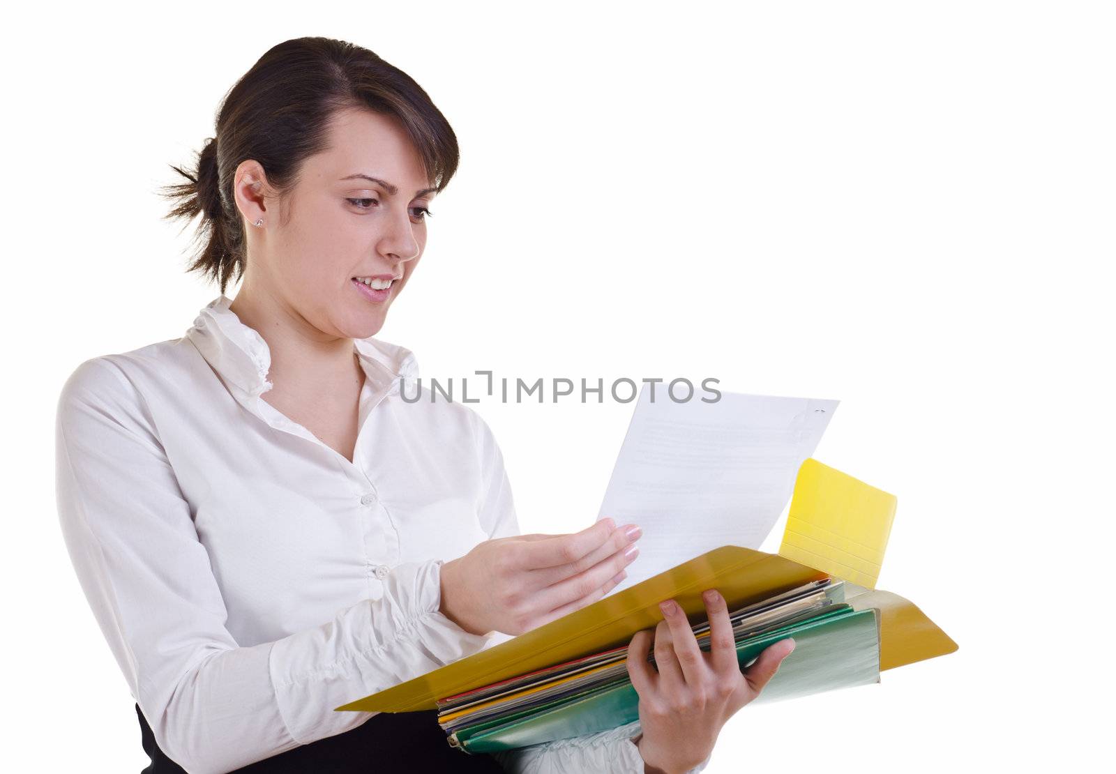 business woman happily holding a pile of files in hand and reading document, high key,  focus on eyes 