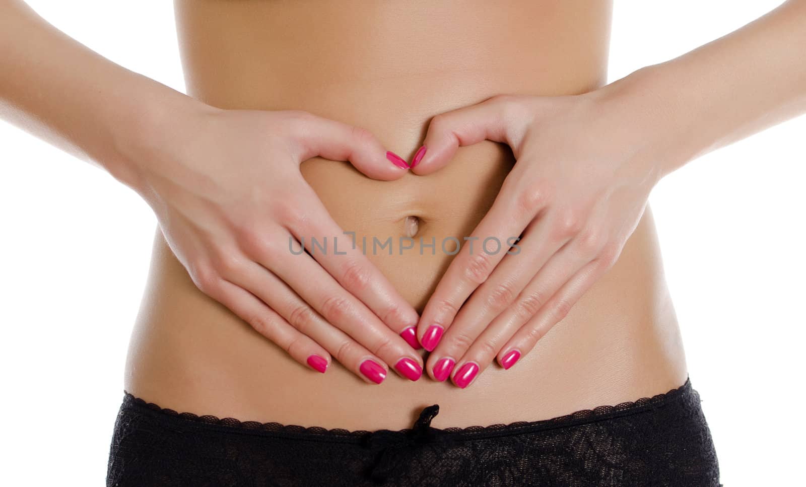 Female making heart shape with her hands on her belly. Isolated on white. by dmitrimaruta