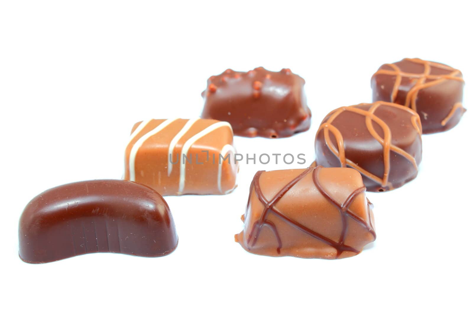 six different types of chocolate candies isolated on white