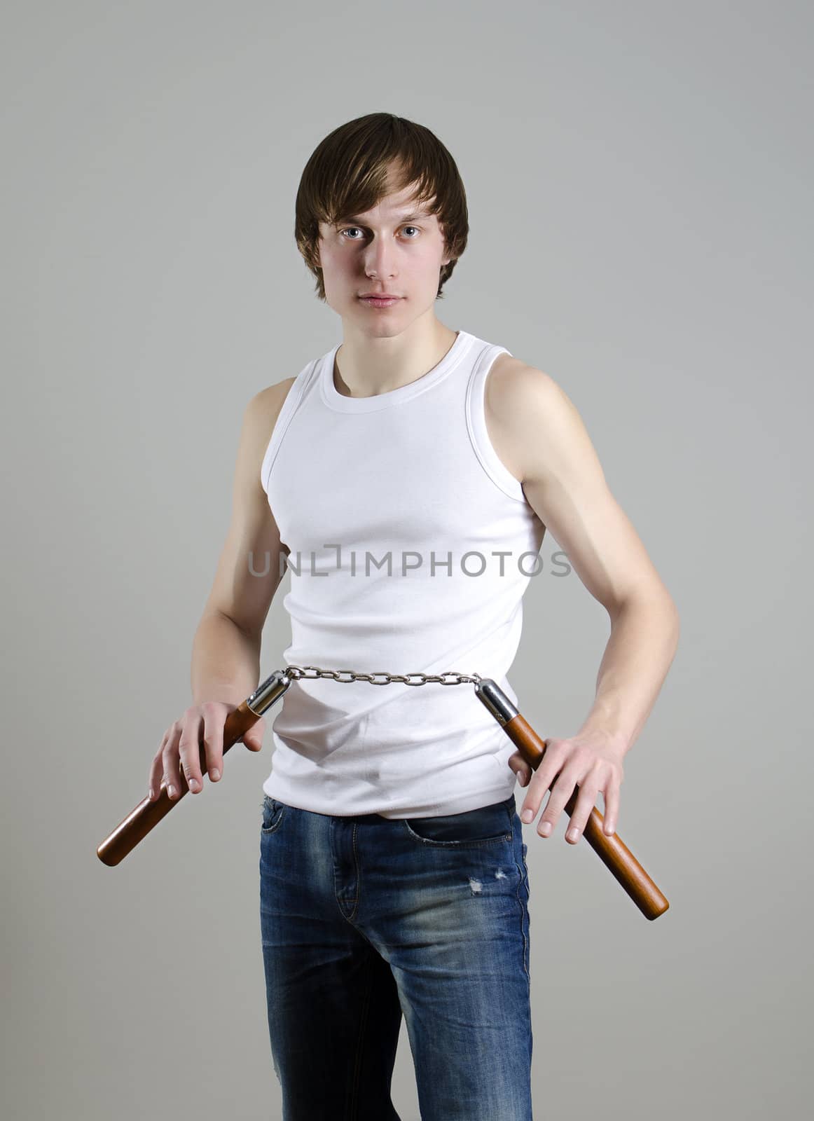 Martial Art. Man with nunchucks
