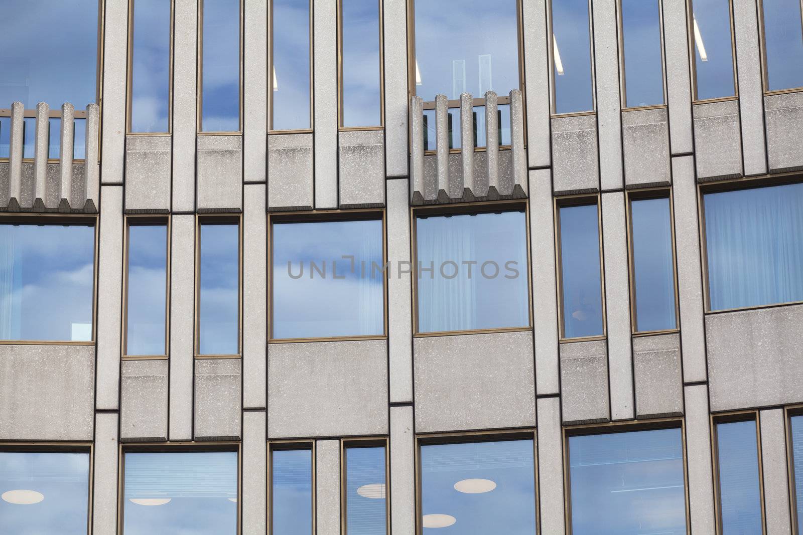 Facade building detail of glass and cement by Portokalis