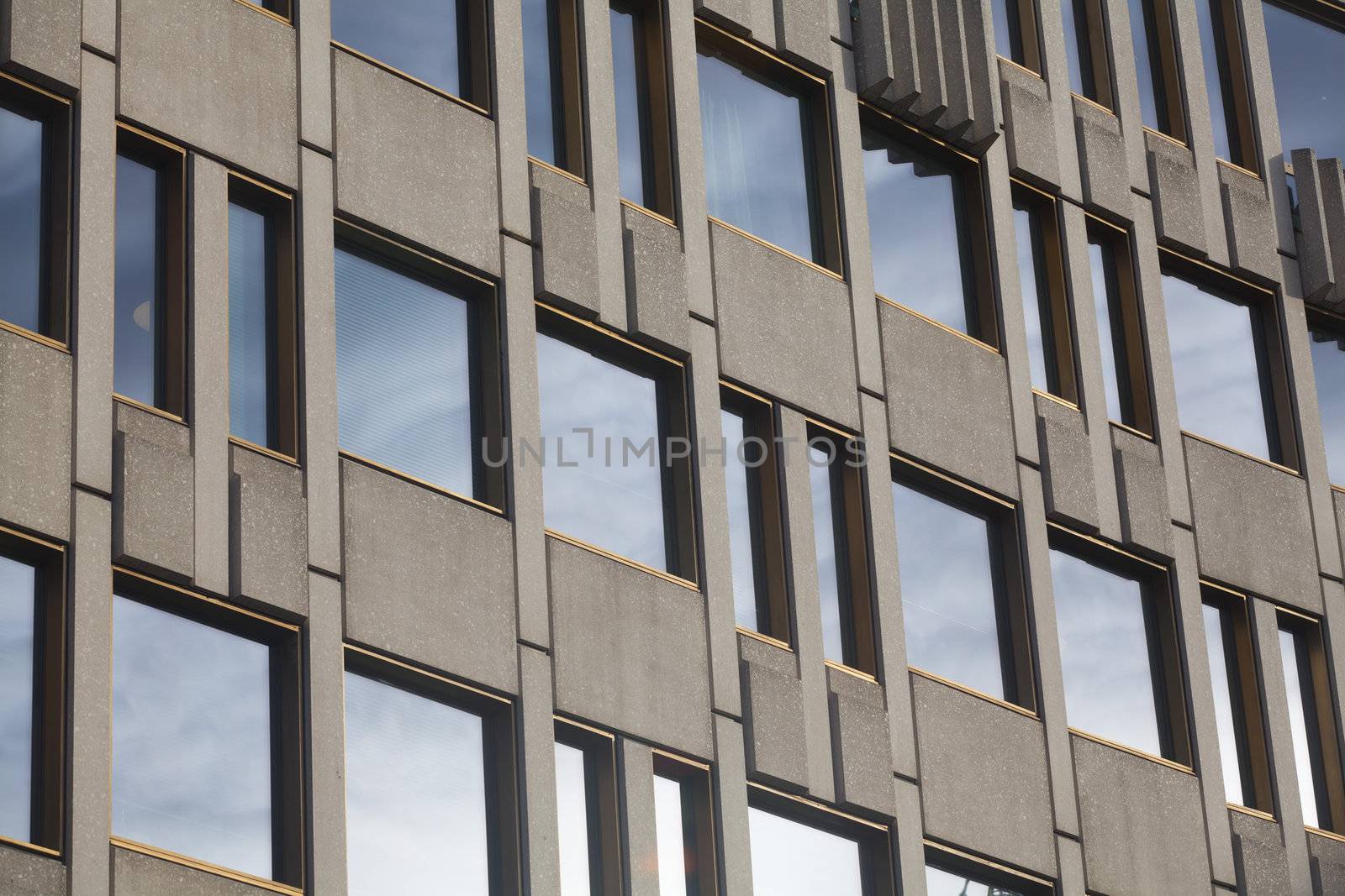 Facade building detail of glass and cement by Portokalis