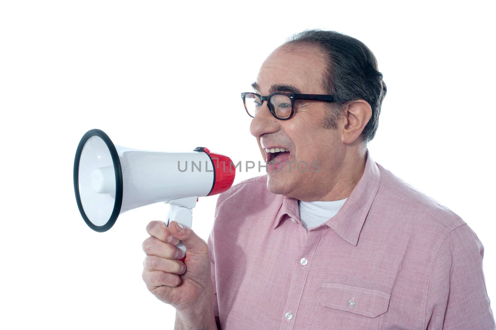 Elder casual man shouting through megaphone by stockyimages