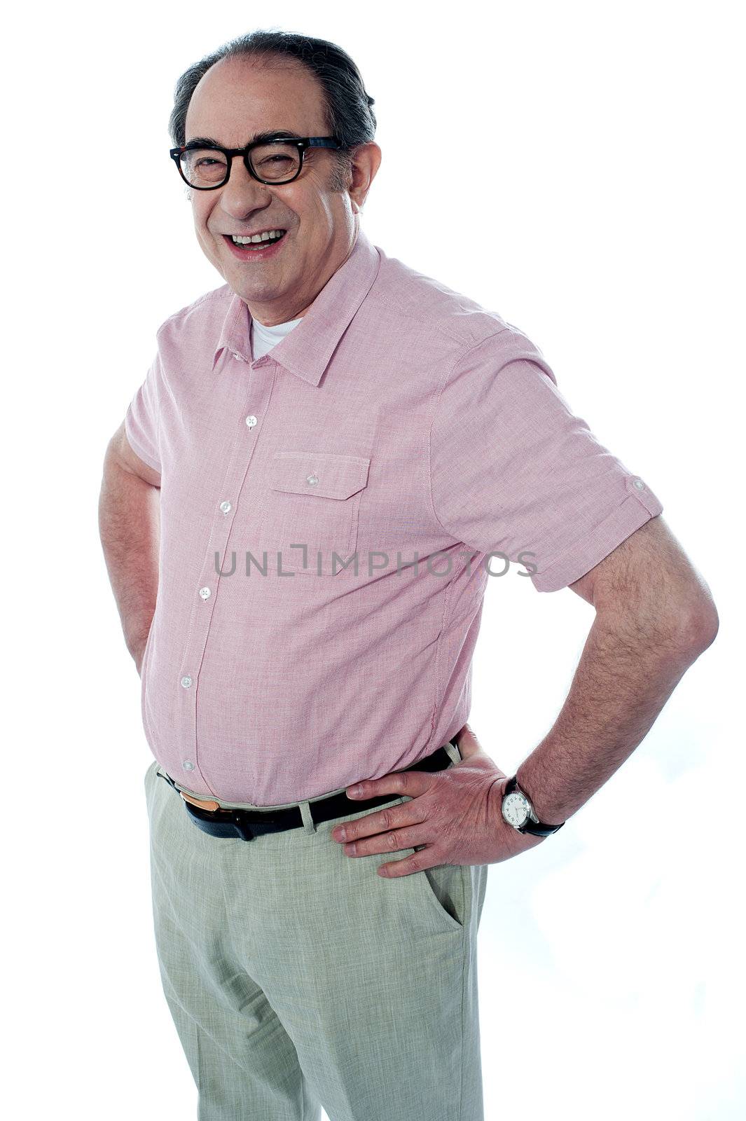 Smiling middle aged casual man standing with hands on his waist. Full length over a white background.