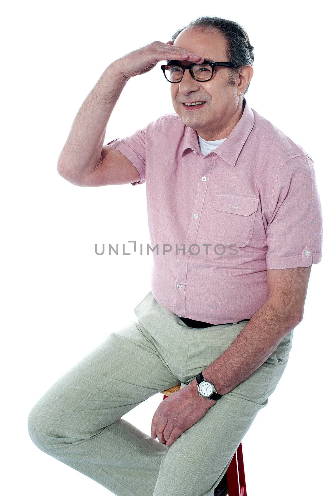 Seated handsome old man looking far away by by stockyimages