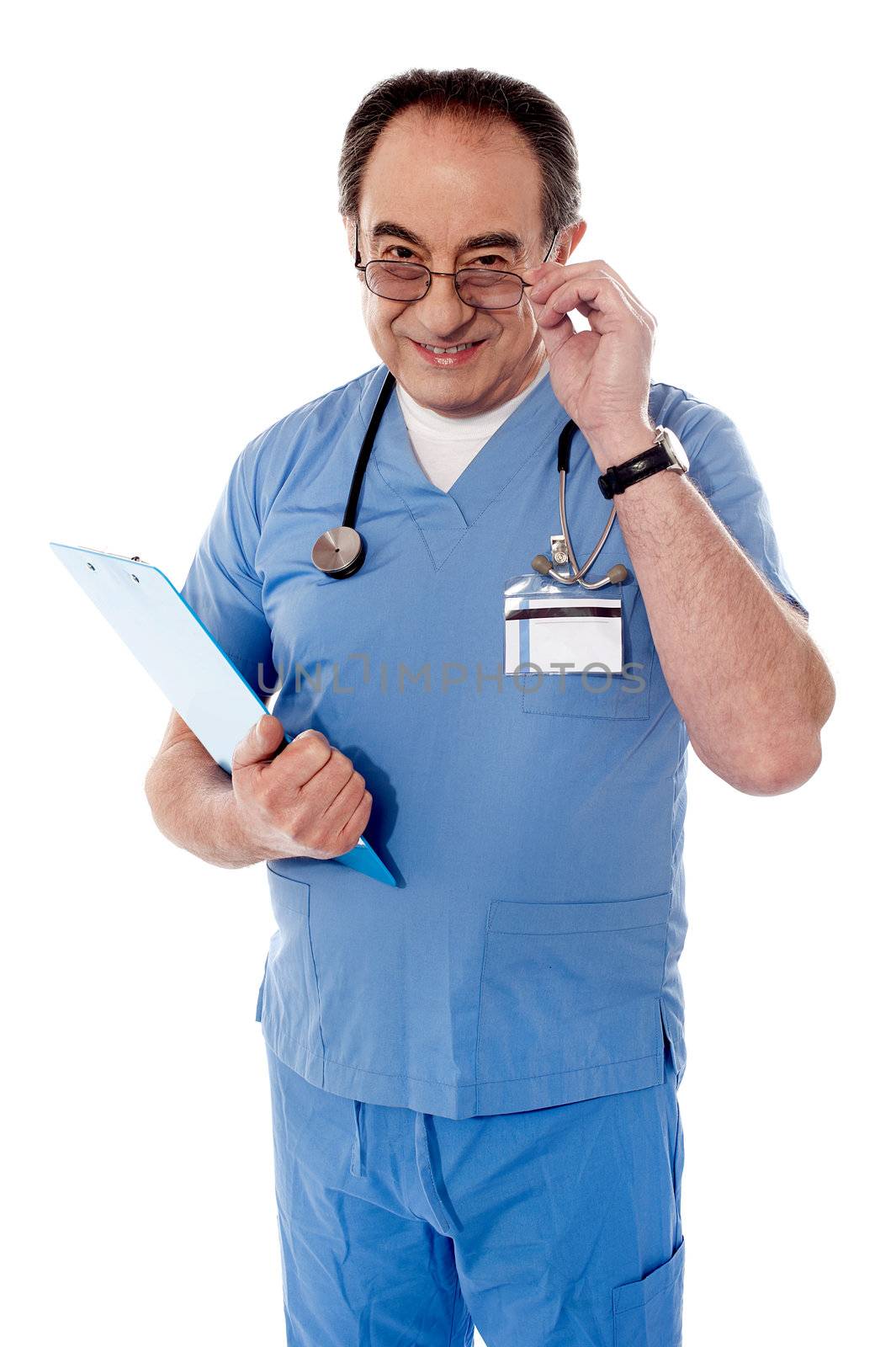 Confident senior doctor, portrait by stockyimages