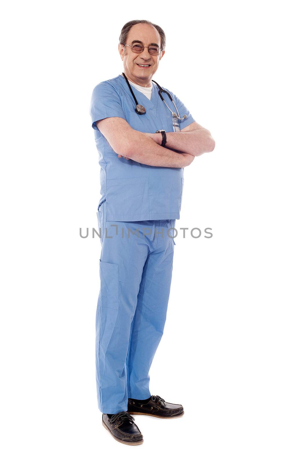Aged medical professional posing with stethoscope around his neck looking at camera