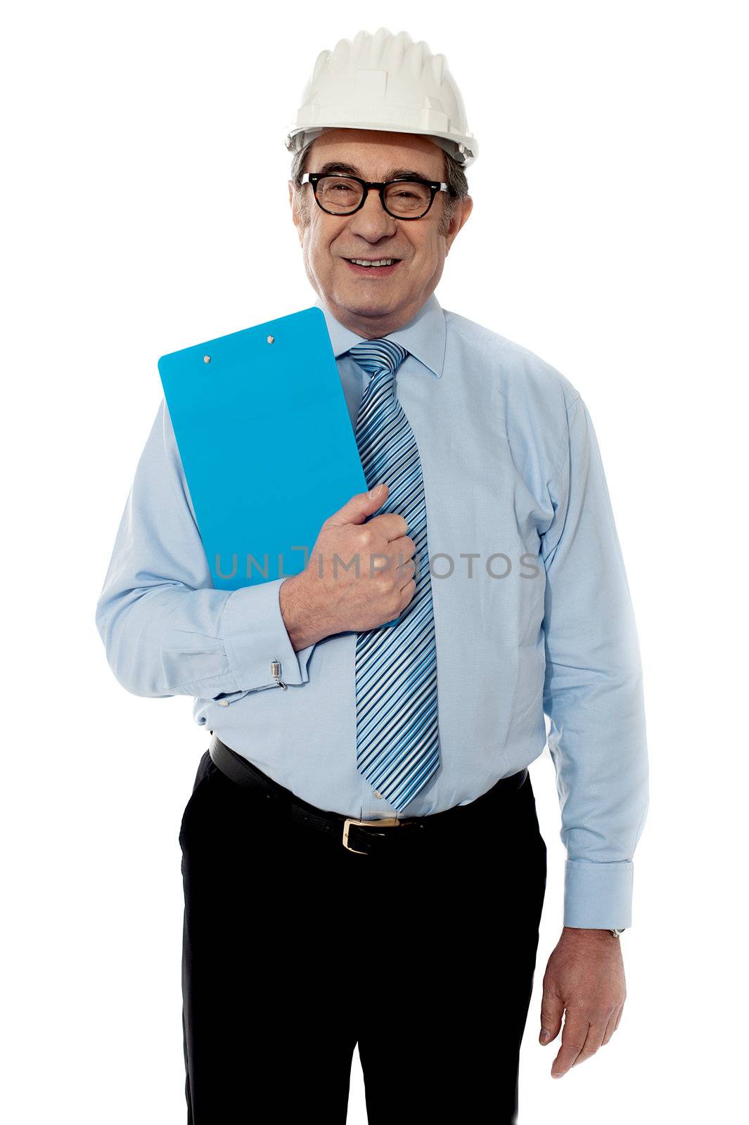 Smiling architect posing in front of camera wearing white hardhat with black trouser