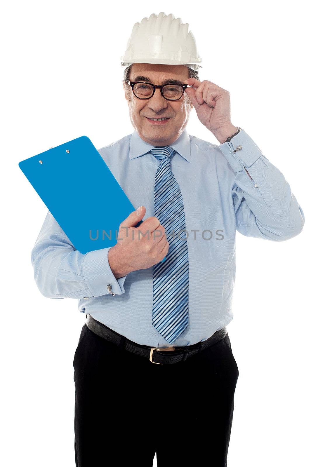 Smiling matured architect holding his eye-wear by stockyimages