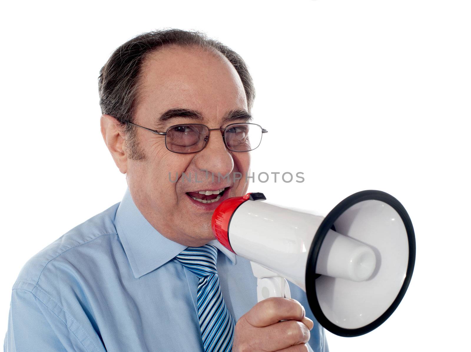 Elderly businessman making an announcement through megaphone