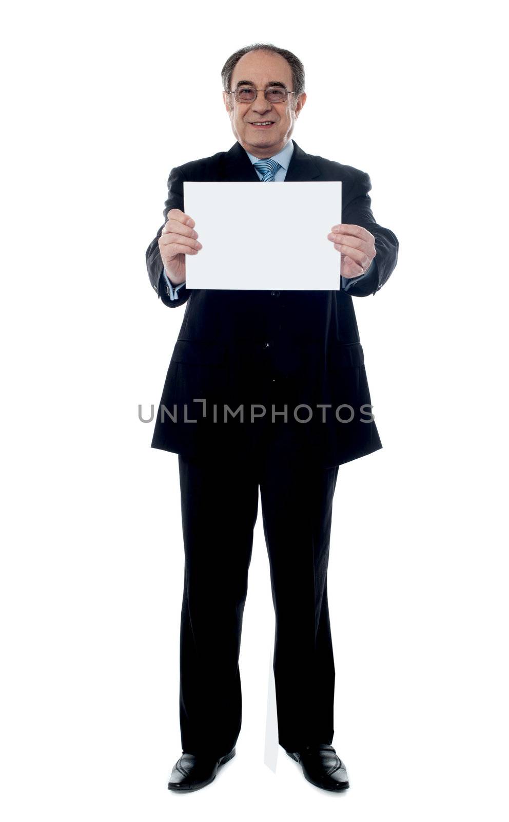 Senior business professional showing blank clipboard to camera isolated on white