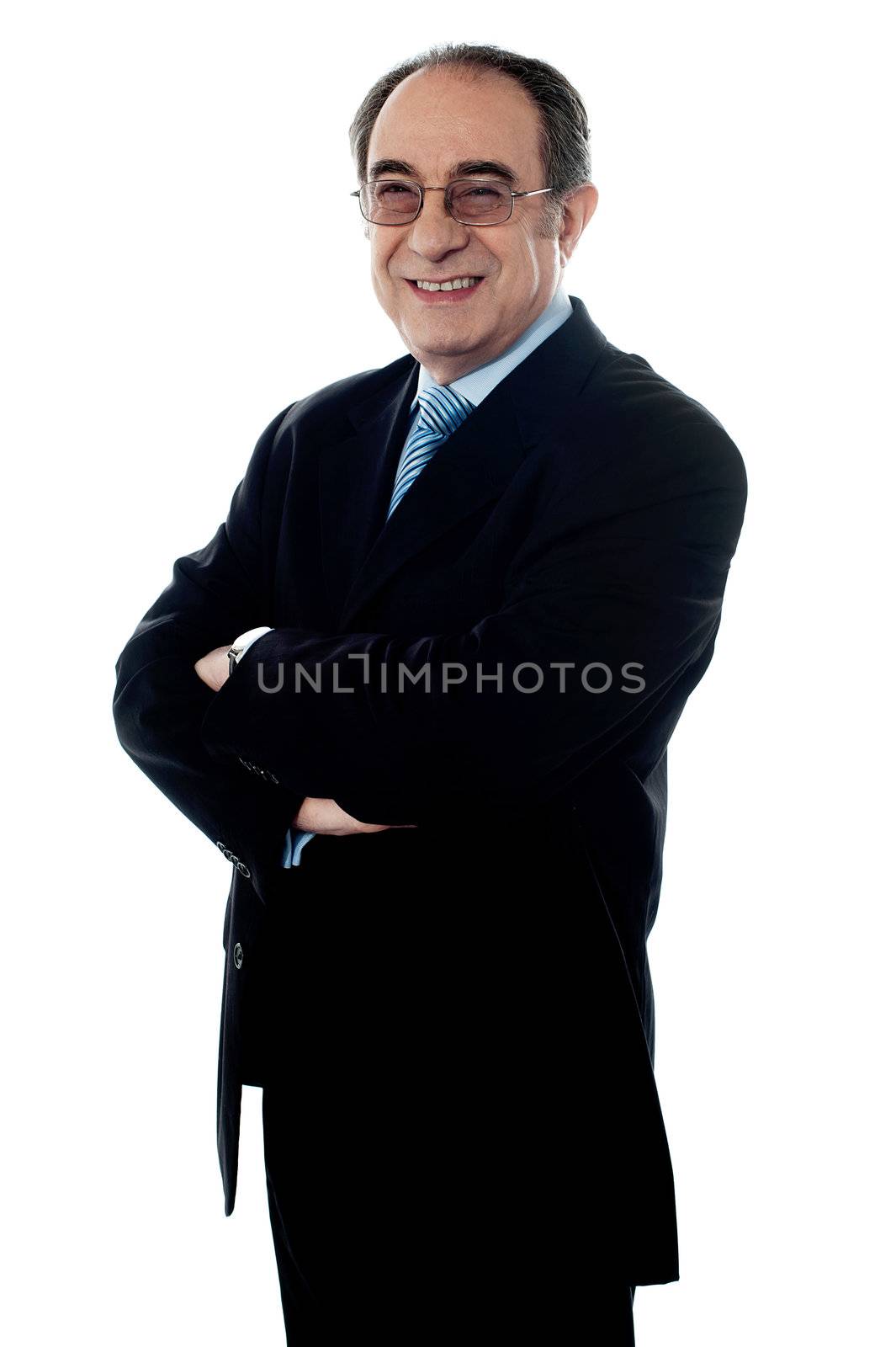 Company director posing with folded hands, smiling at camera