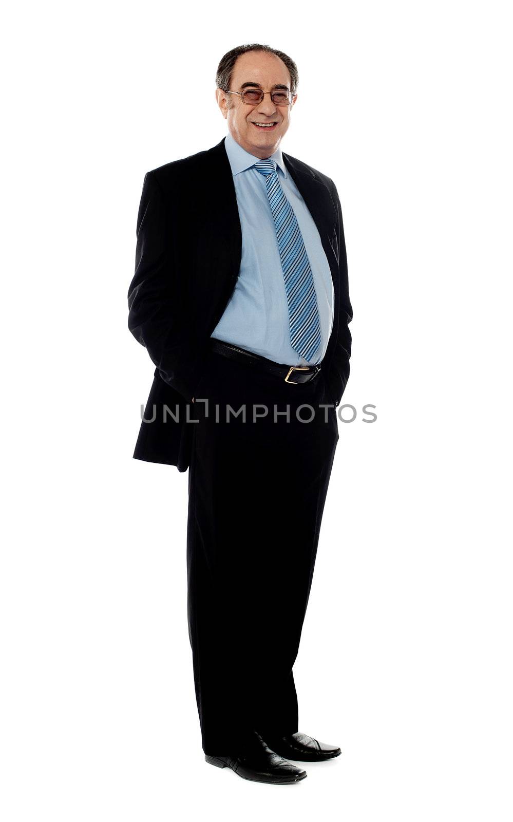 Company director posing in style with arms in pocket