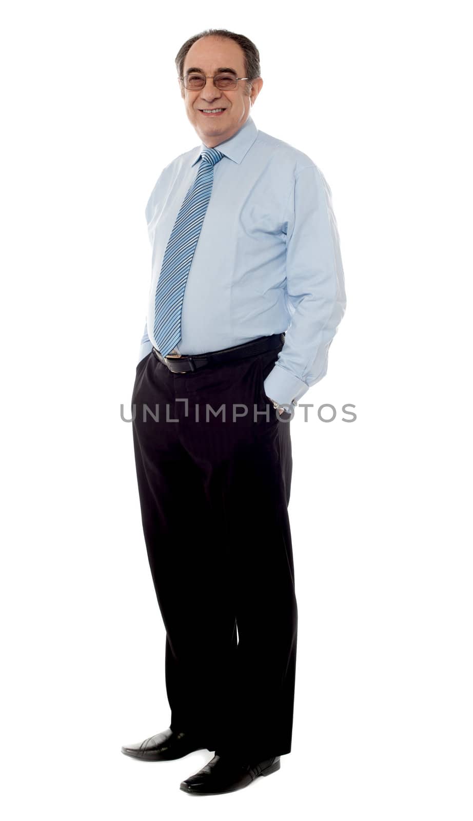 Side view of a stylish senior executive by stockyimages