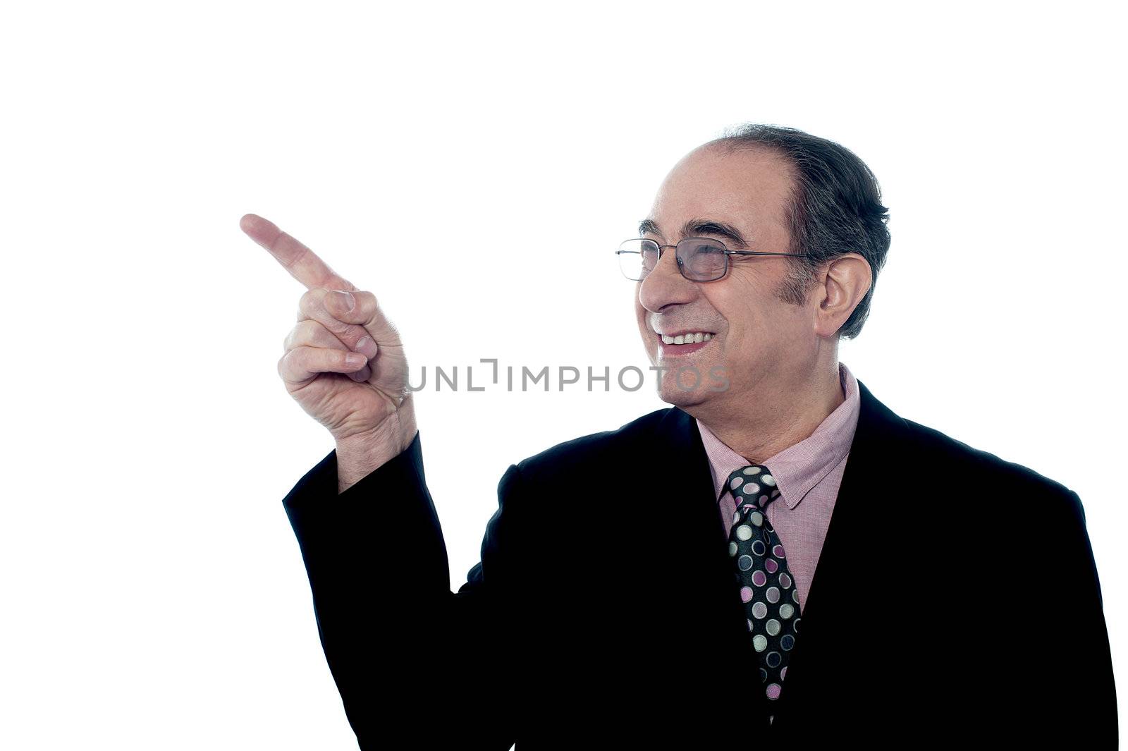 Senior director indicating up for something interesting on white background