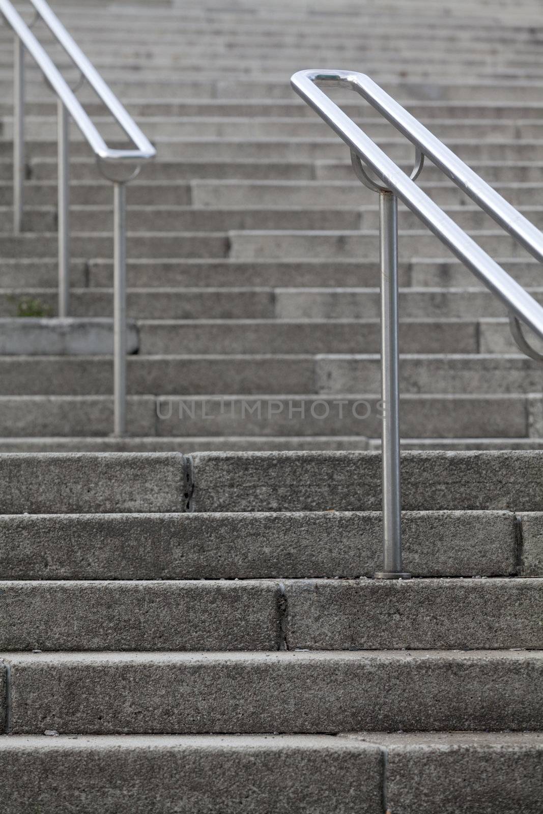 Scenic of clean outdoor steps in public places with metallic handrail