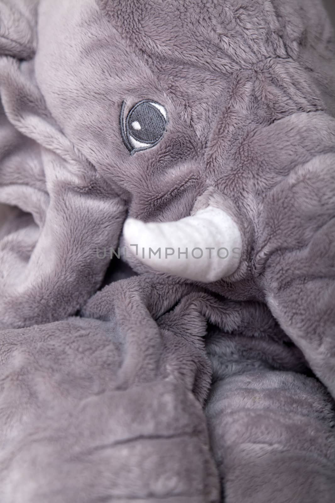 Elephant stuffed toy in gray tones