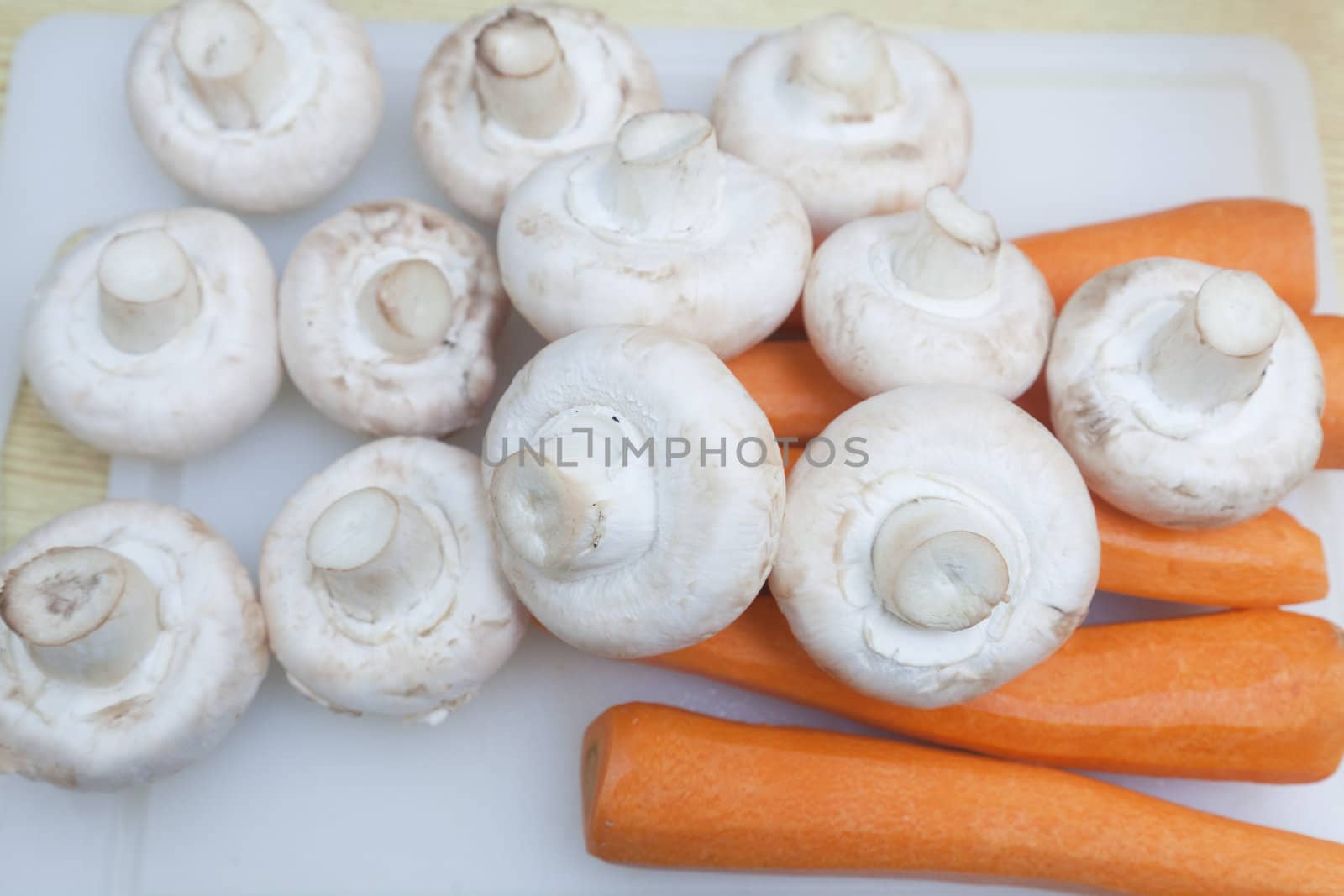 Carrots and mushrooms by Portokalis