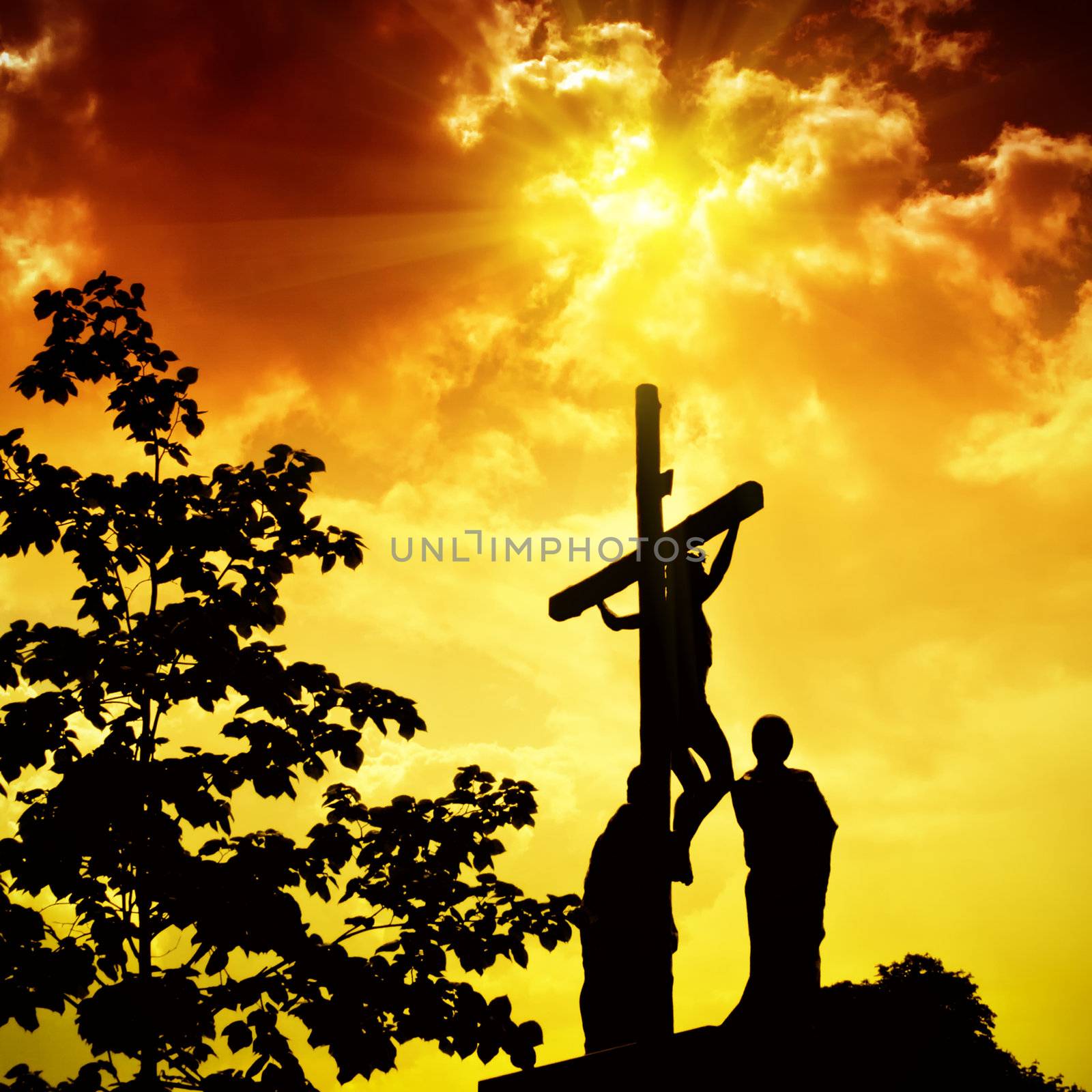 Crucifixion of Jesus Christ with dramatic sky in background