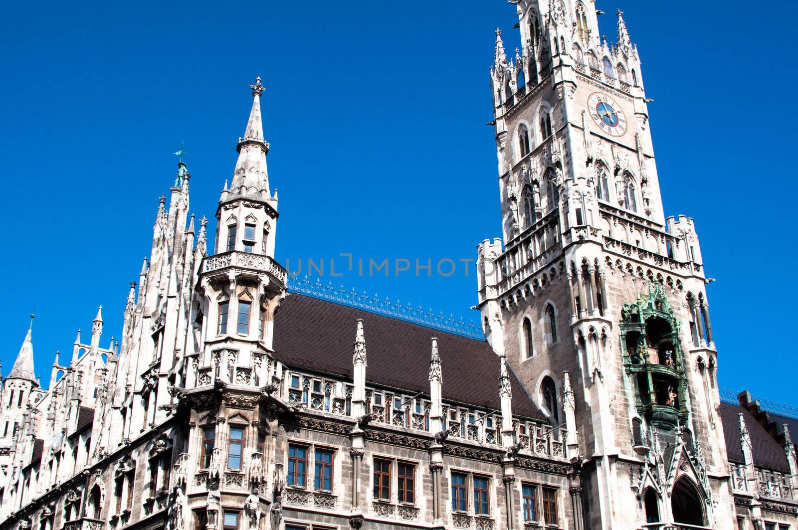 Munich City Hall ;Marienplatz (Town Hall) with its mechanical clock, or Glockenspiel, in Munich, Germany.