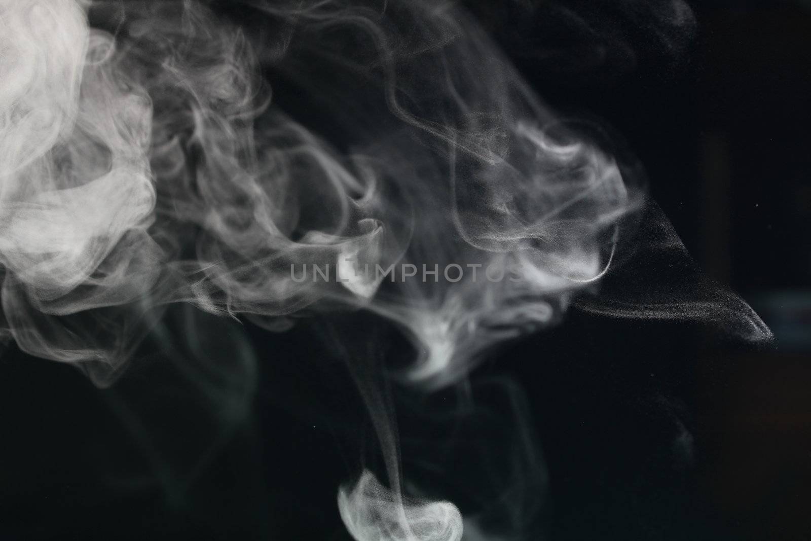 an abstract smoke picture in front of a black background