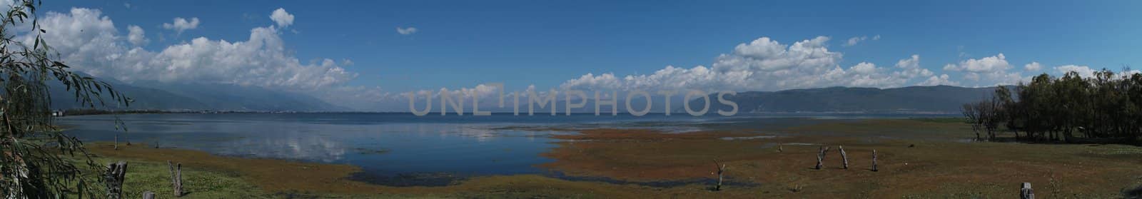 Panoramic photo of the lake of Dali, in China. This photo is made attaching together various photos.